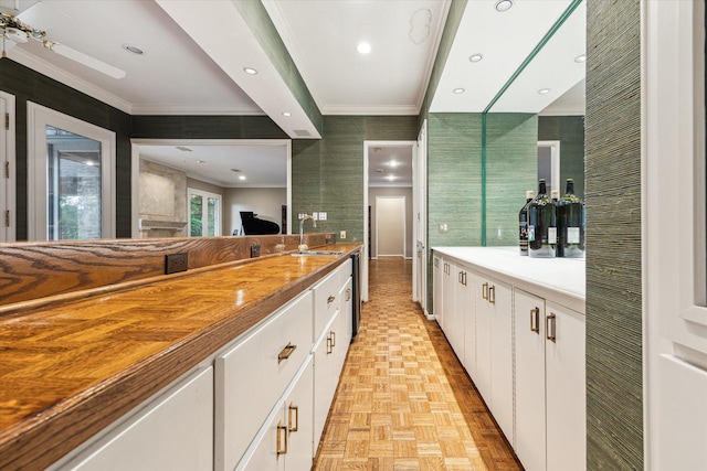 bathroom featuring crown molding and vanity