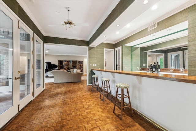 bar featuring ornamental molding, a ceiling fan, baseboards, and recessed lighting
