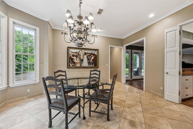 dining space with a chandelier, crown molding, baseboards, and light tile patterned floors