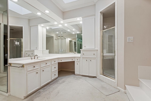 full bath featuring recessed lighting, a skylight, a shower stall, crown molding, and baseboards
