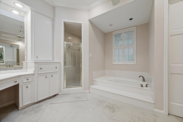 bathroom featuring a stall shower, a garden tub, a ceiling fan, ornamental molding, and vanity