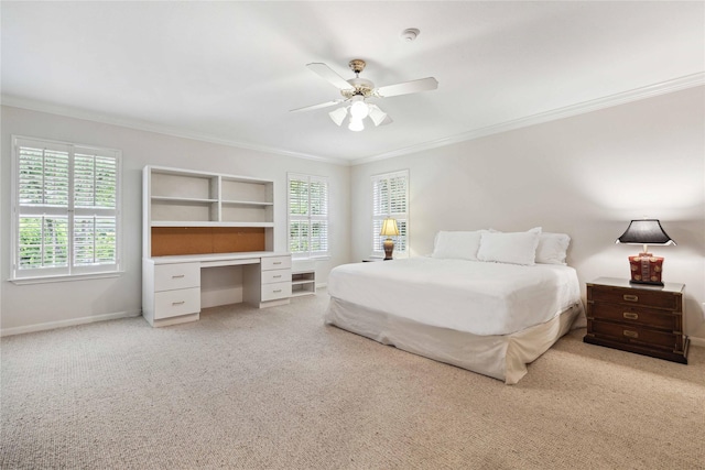 bedroom with ornamental molding, light colored carpet, an office area, baseboards, and ceiling fan