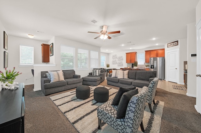living area featuring healthy amount of natural light, a ceiling fan, recessed lighting, and baseboards