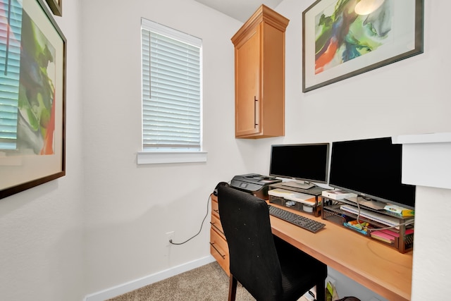 office space with carpet and baseboards
