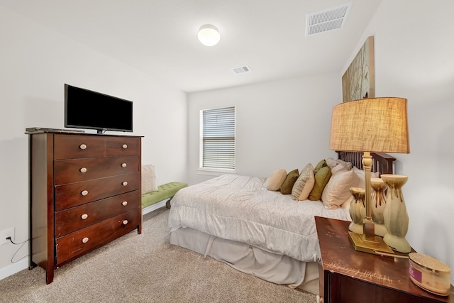 bedroom featuring light carpet