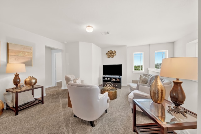 living room with carpet and baseboards