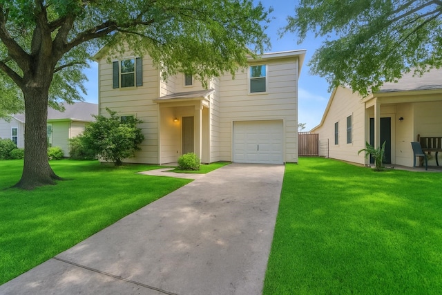traditional-style house with concrete driveway, a garage, and a front lawn
