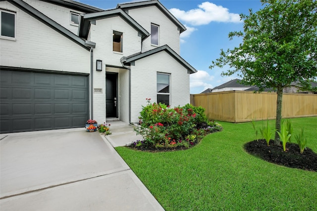 22110 Sam Raburn Dr, Tomball, TX 77375 - traditional home featuring brick siding, a garage, and concrete driveway