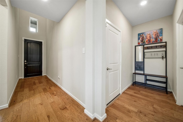 22110 Sam Raburn Dr, Tomball, TX 77375 - doorway featuring light wood finished floors and baseboards