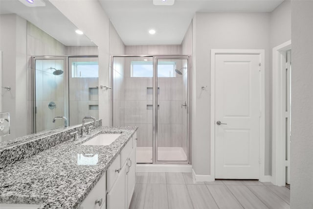 22110 Sam Raburn Dr, Tomball, TX 77375 - full bathroom featuring a shower stall, vanity, baseboards, and tile patterned flooring