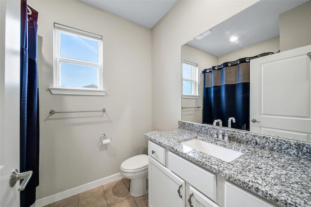 22110 Sam Raburn Dr, Tomball, TX 77375 - full bathroom featuring tile patterned flooring, baseboards, toilet, vanity, and curtained shower