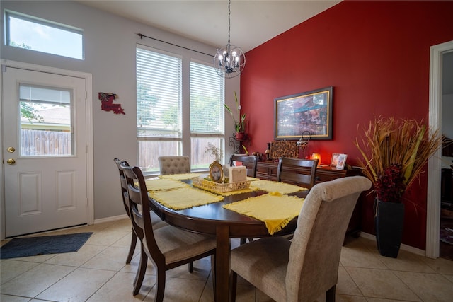 32102 Annice Ln, Pinehurst, TX 77362 - dining space with a chandelier, plenty of natural light, light tile patterned floors, and baseboards