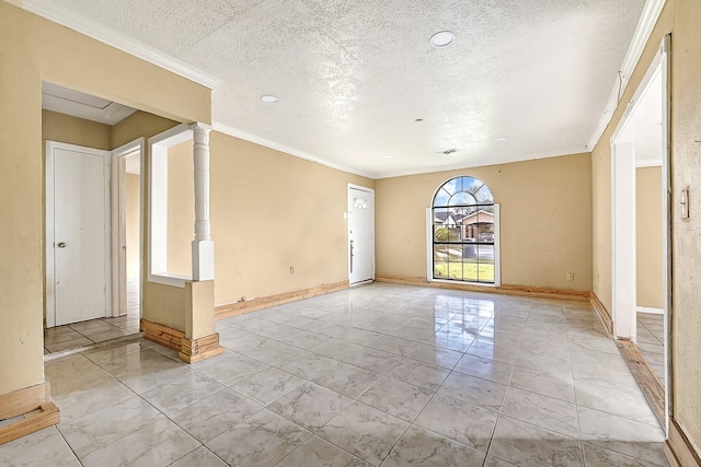 empty room with a textured ceiling, crown molding, baseboards, and recessed lighting