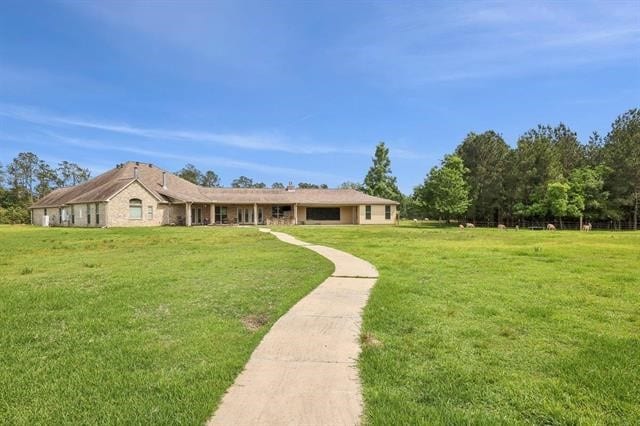 2014 Fish Lake Rd, Kountze, TX 77625 - ranch-style house featuring a front yard