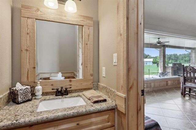 2014 Fish Lake Rd, Kountze, TX 77625 - bathroom with vanity and tile patterned floors