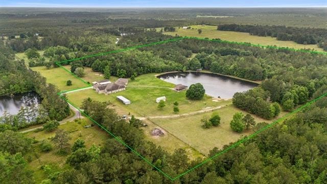 2014 Fish Lake Rd, Kountze, TX 77625 - drone / aerial view of a large body of water and a heavily wooded area
