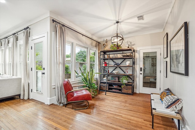 813 Key St, Houston, TX 77009 - sitting room with hardwood / wood-style flooring, a chandelier, and baseboards