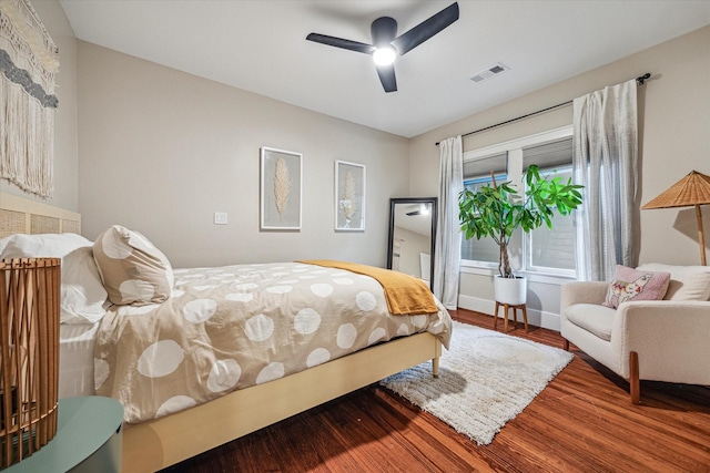 813 Key St, Houston, TX 77009 - bedroom featuring wood finished floors, baseboards, and a ceiling fan