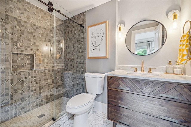 full bathroom featuring toilet, a stall shower, vanity, and tile patterned flooring
