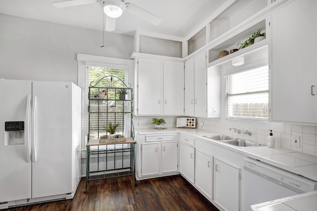 710 Woodland St, Houston, TX 77009 - kitchen featuring white appliances, a sink, backsplash, and light countertops