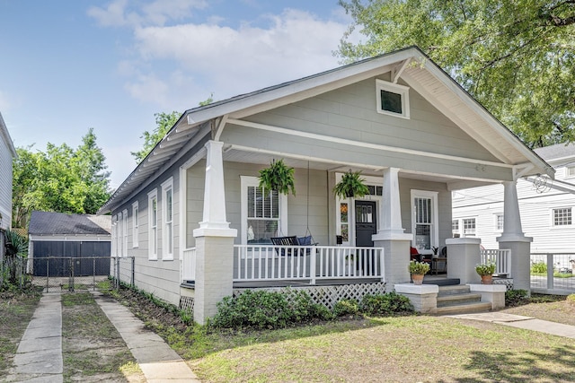 710 Woodland St, Houston, TX 77009 - view of front of property featuring covered porch and fence