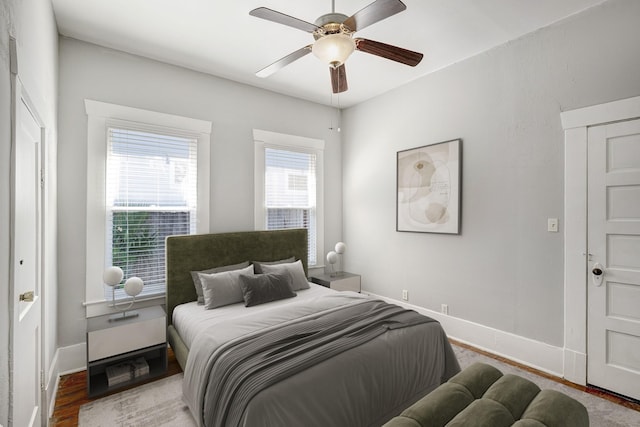 710 Woodland St, Houston, TX 77009 - bedroom with baseboards, a ceiling fan, and wood finished floors