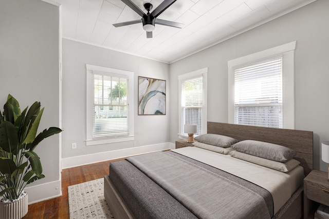 710 Woodland St, Houston, TX 77009 - bedroom with wood finished floors, baseboards, and ceiling fan