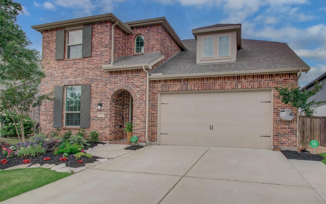 7111 Pondhawk Dr, Katy, TX 77493 - traditional-style house featuring brick siding, concrete driveway, a garage, and a shingled roof