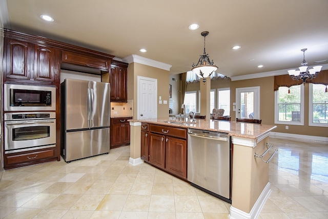 7010 Mcclellan Ln, Sugar Land, TX 77479 - kitchen with stainless steel appliances, a chandelier, a sink, crown molding, and recessed lighting