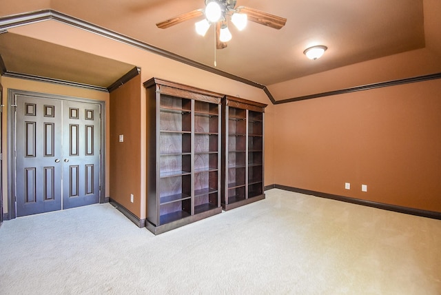7010 Mcclellan Ln, Sugar Land, TX 77479 - spare room featuring carpet floors, ceiling fan, baseboards, crown molding, and vaulted ceiling