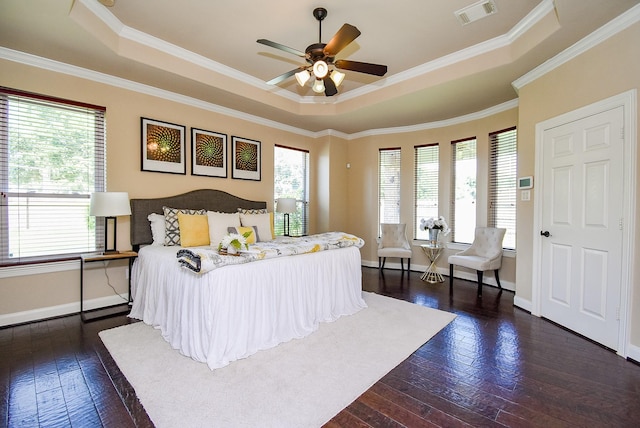 7003 Paxton Ct, Sugar Land, TX 77479 - bedroom featuring a tray ceiling, dark wood-style floors, baseboards, crown molding, and a ceiling fan