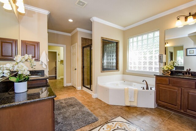 7003 Paxton Ct, Sugar Land, TX 77479 - bathroom with a stall shower, a bath, vanity, ornamental molding, and tile patterned flooring
