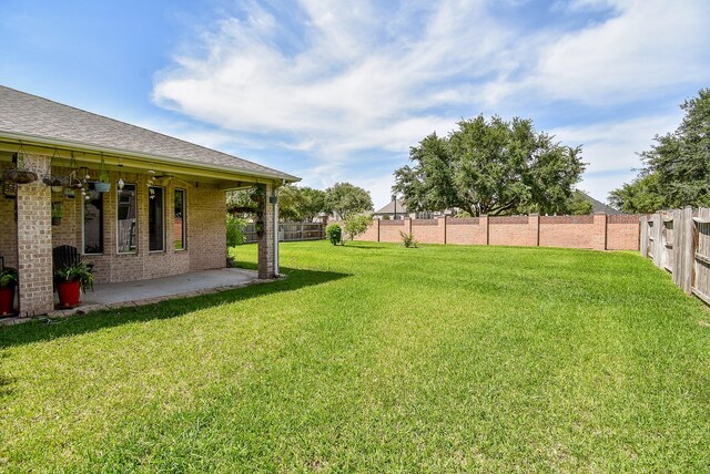 7003 Paxton Ct, Sugar Land, TX 77479 - view of yard featuring a patio