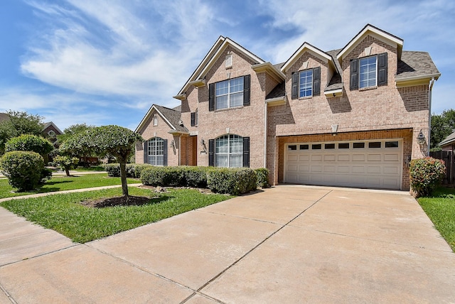 7003 Paxton Ct, Sugar Land, TX 77479 - traditional-style house with brick siding, a front lawn, driveway, and an attached garage