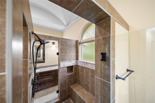 10317 Windsor Ln, Stafford, TX 77031 - bathroom featuring a tile shower and vanity