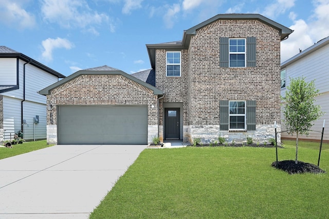 traditional-style house featuring brick siding, a garage, a front lawn, and driveway