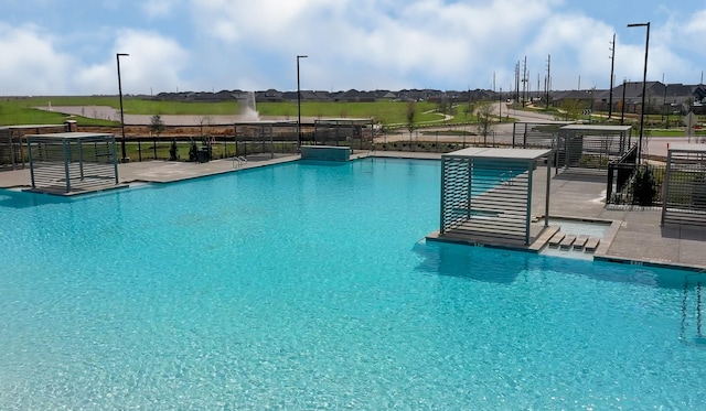 community pool featuring fence