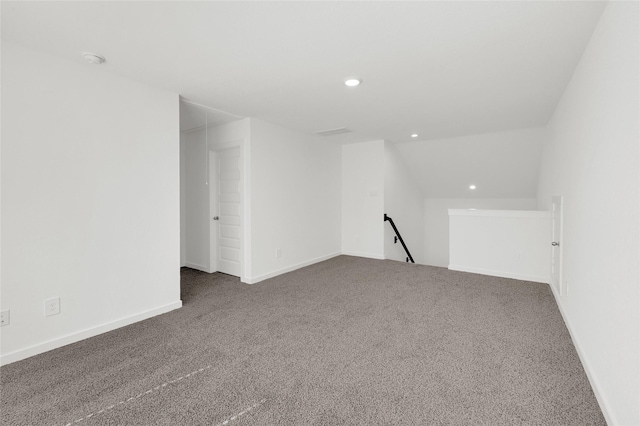 additional living space featuring carpet, recessed lighting, lofted ceiling, and baseboards
