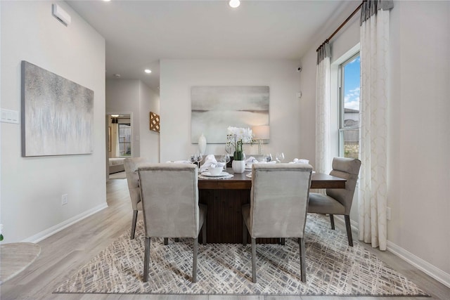 16809 Needlepoint Dr, Conroe, TX 77302 - dining area with baseboards, wood finished floors, and recessed lighting