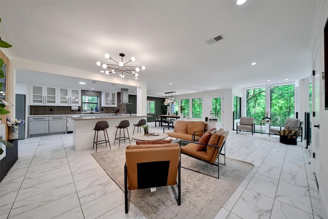 140 S Timber Top Dr, Spring, TX 77380 - living room featuring a chandelier, light marble finish floors, and recessed lighting