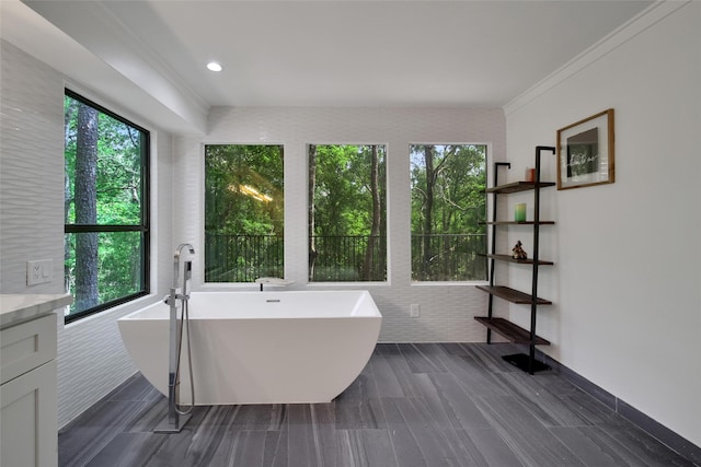 140 S Timber Top Dr, Spring, TX 77380 - full bathroom featuring a freestanding bath, vanity, and ornamental molding