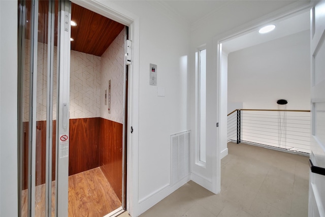 140 S Timber Top Dr, Spring, TX 77380 - corridor featuring an upstairs landing, elevator, recessed lighting, crown molding, and wainscoting