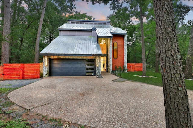 140 S Timber Top Dr, Spring, TX 77380 - view of front of property with metal roof, a garage, fence, stone siding, and a barn