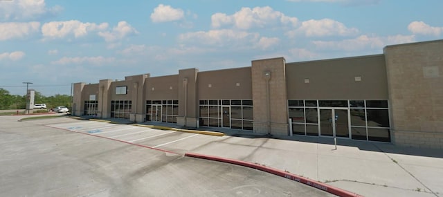 6051 Garth Rd Unit 3, Baytown, TX 77521 - view of property featuring uncovered parking
