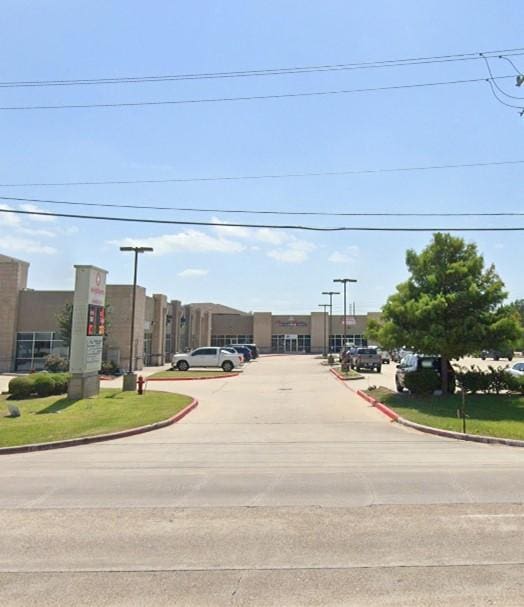 6051 Garth Rd Unit 3, Baytown, TX 77521 - view of concrete road featuring curbs