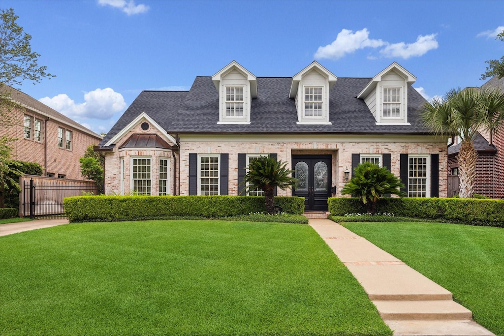 6212 Olympia Dr, Houston, TX 77057 - view of front facade featuring brick siding, a shingled roof, and french doors