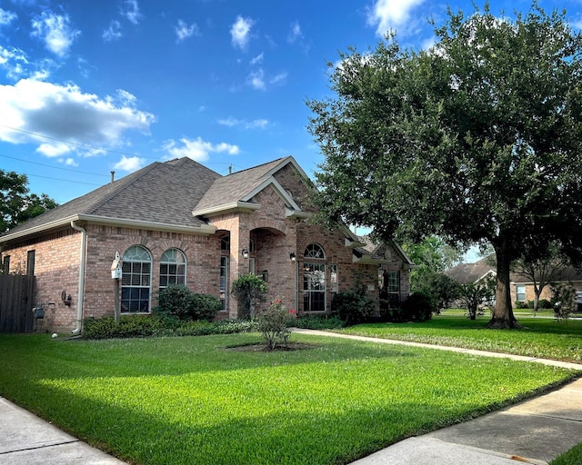 3002 Sandleigh Dr, Spring, TX 77388 - view of front of home featuring brick siding and roof with shingles