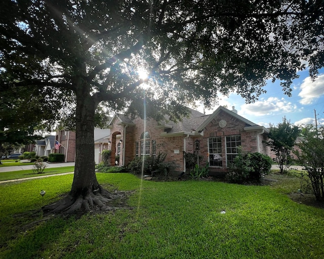 3002 Sandleigh Dr, Spring, TX 77388 - view of front facade with brick siding and a front yard