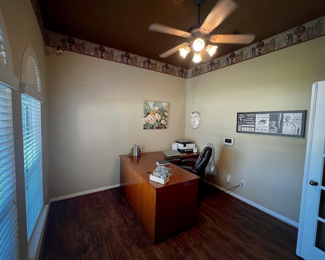 home office featuring a ceiling fan, baseboards, and wood finished floors
