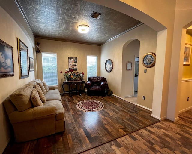 3002 Sandleigh Dr, Spring, TX 77388 - living area featuring arched walkways, ornamental molding, hardwood / wood-style flooring, an ornate ceiling, and baseboards